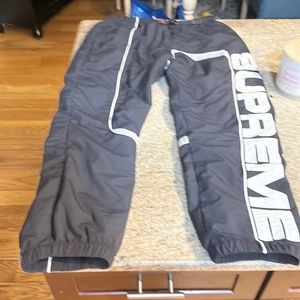 Black supreme track pants